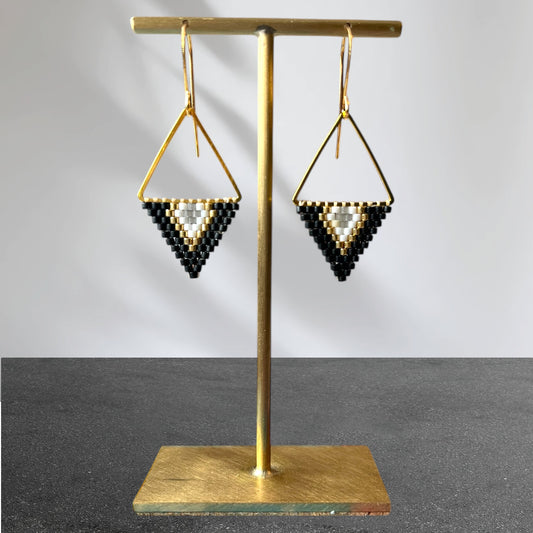 Matte black, gold coloured, white and smokey faceted crystal beaded earrings.