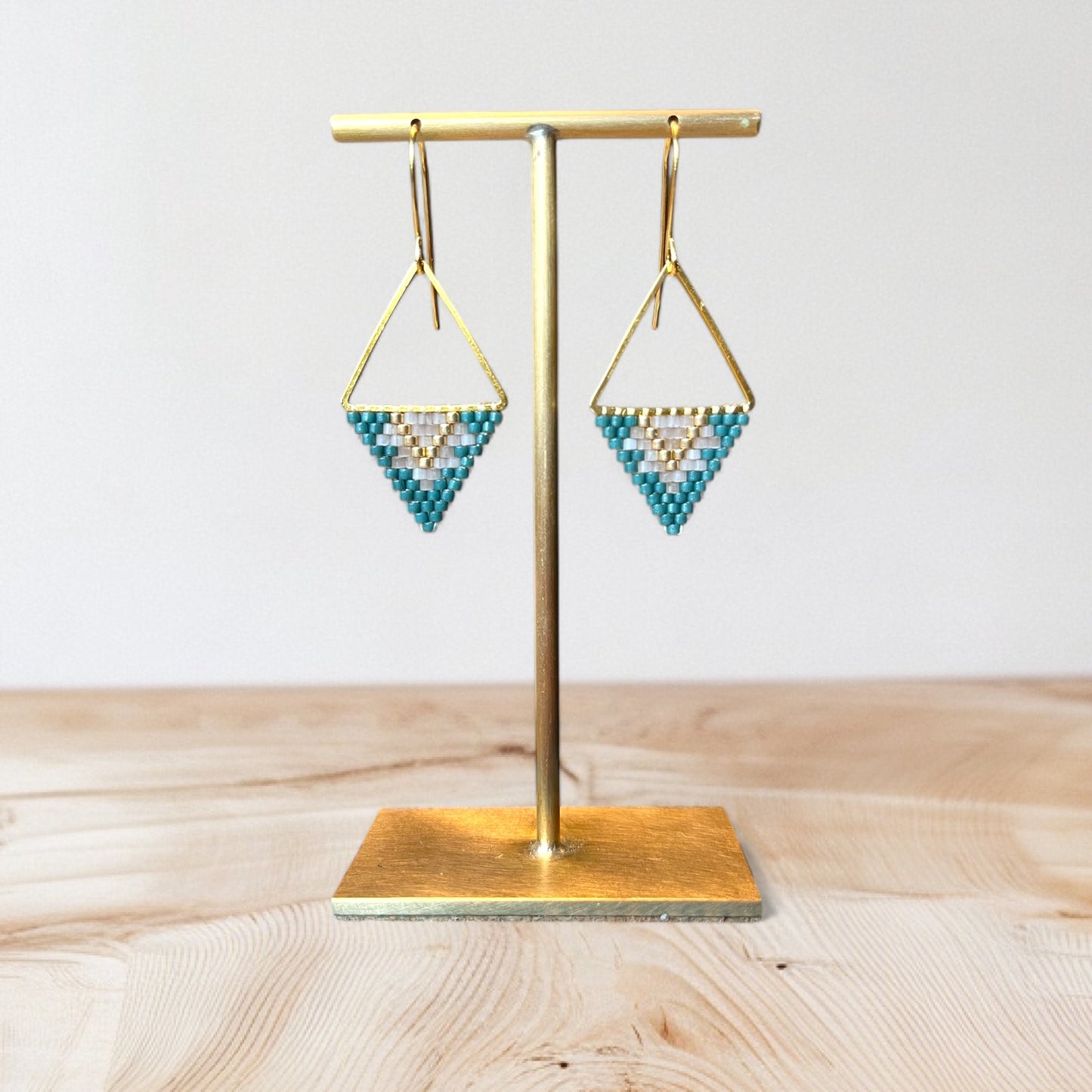 Spruce green, gold coloured and white faceted crystal beaded earrings.